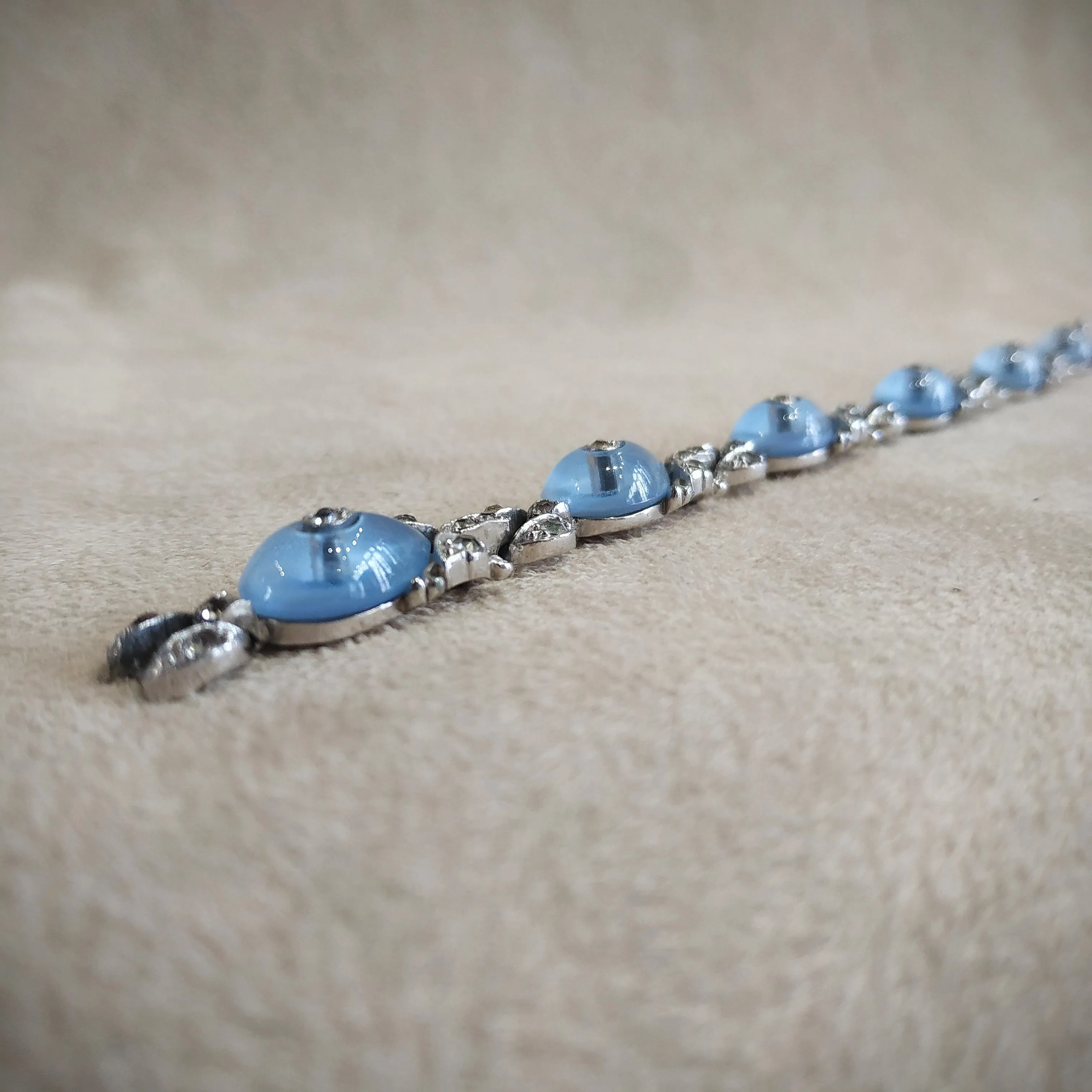 Icy blue moonglow shoe button vintage Trifari bracelet by Alfred Philippe